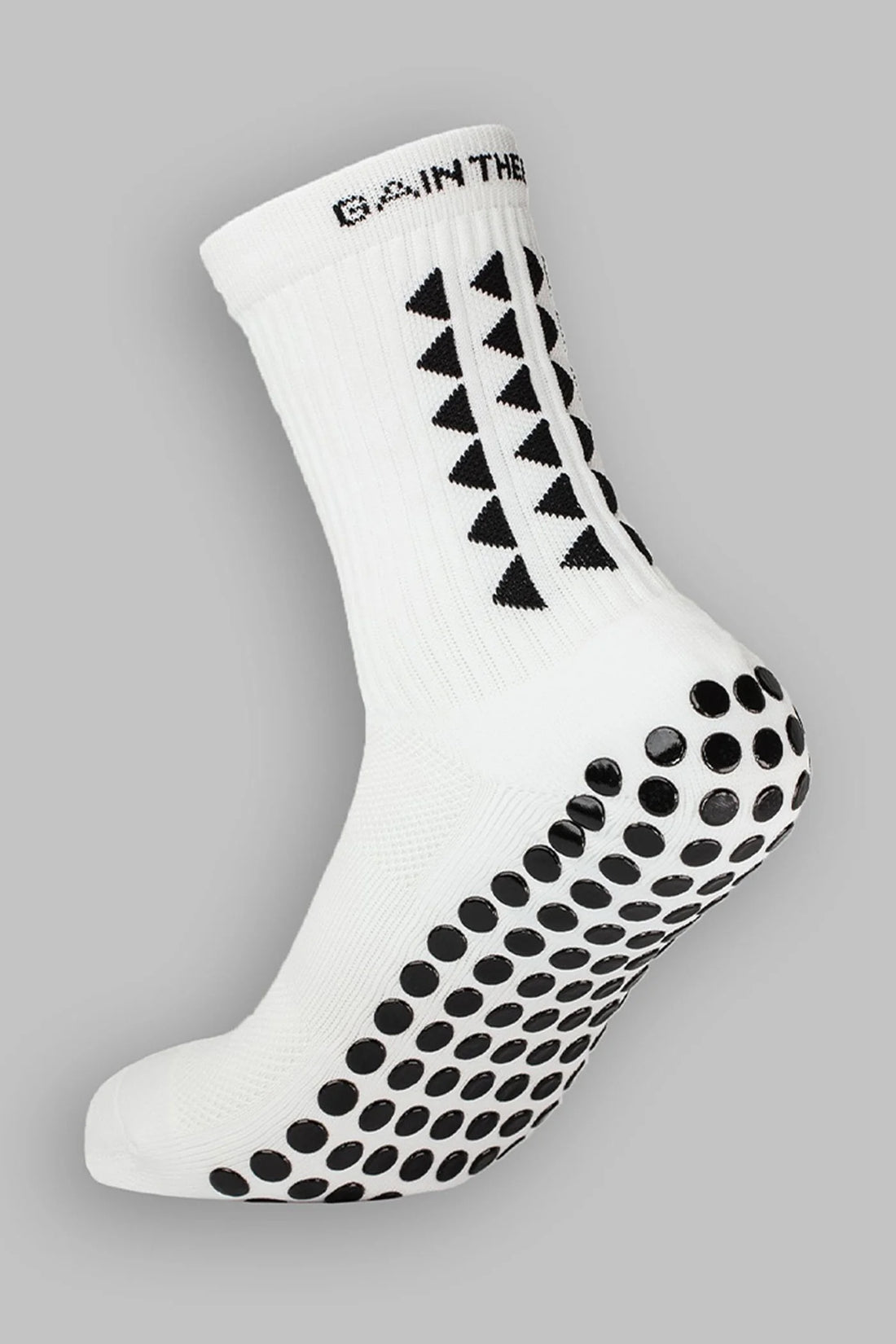 A pair of grip socks showcasing their non-slip soles, highlighting the effectiveness of grip socks.